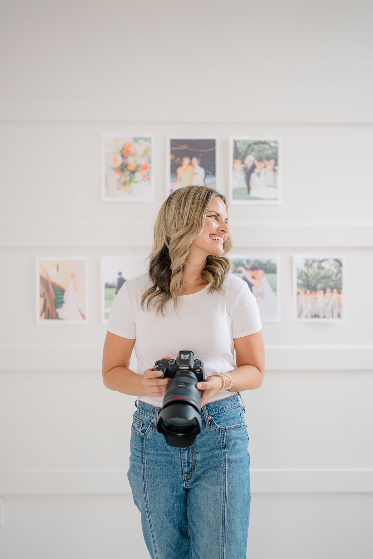 Jennie in her studio holding her camera